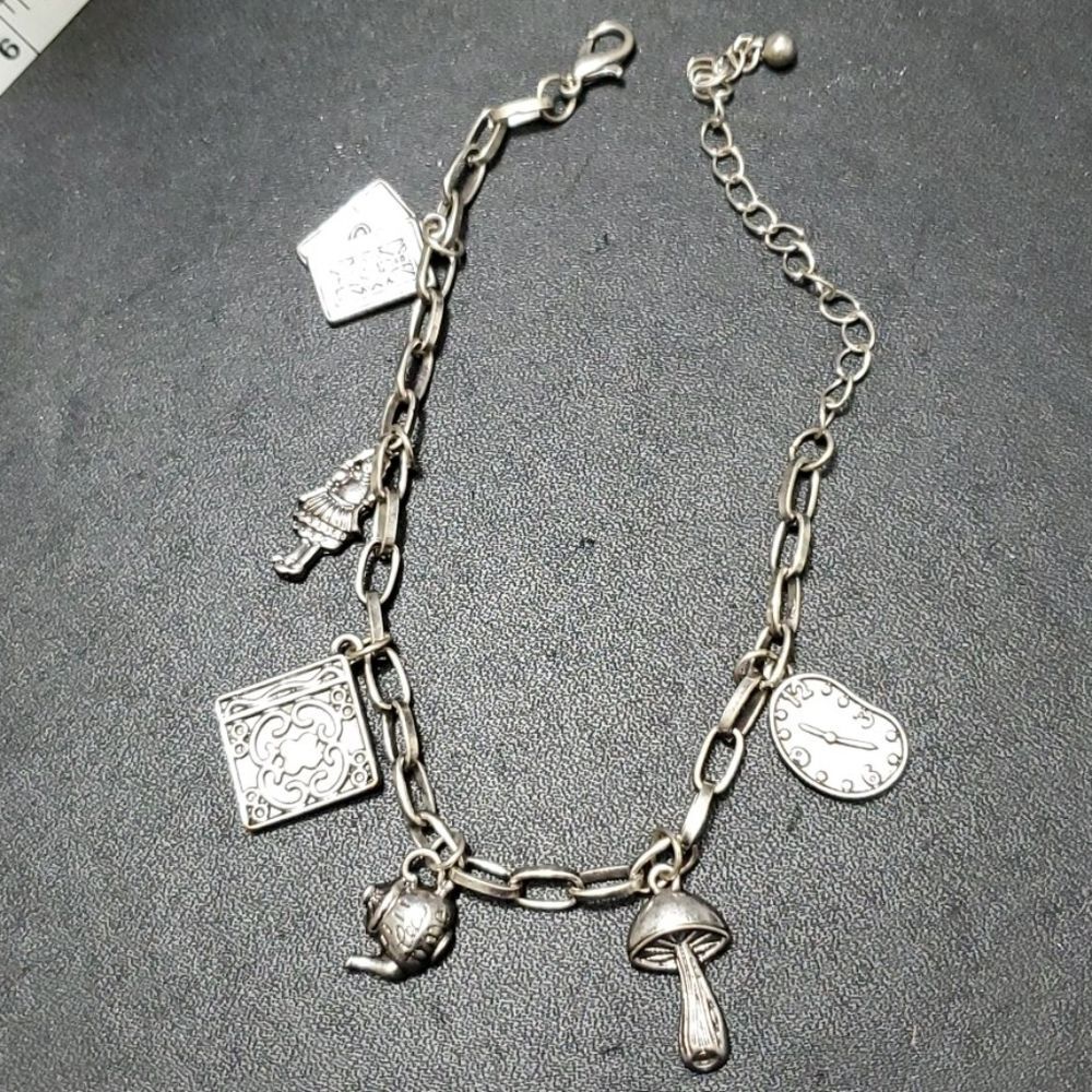 Silver tone Alice in wonderland themed bracelet up to 10"